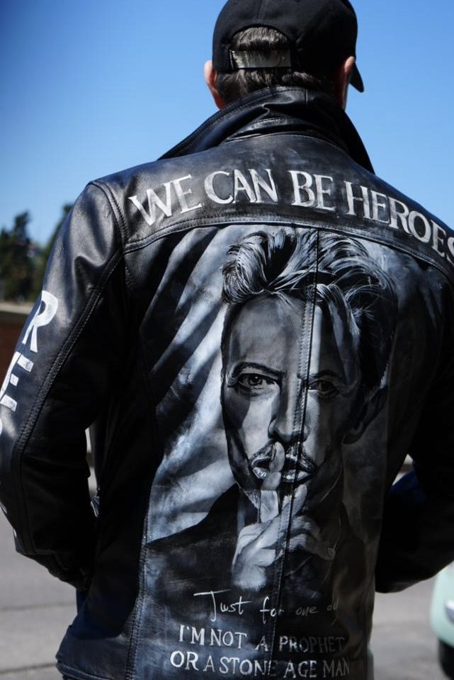 A hand-painted Katian leather jacket reading We can be heroes
